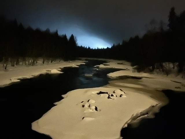       Winter river landscape under dark sky.
  