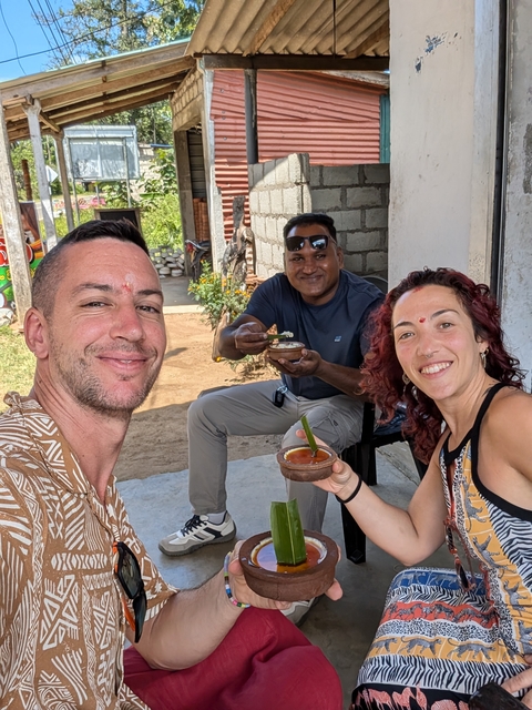 Three people enjoying a local meal together.