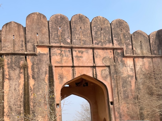 An ancient fortification with a large gateway.