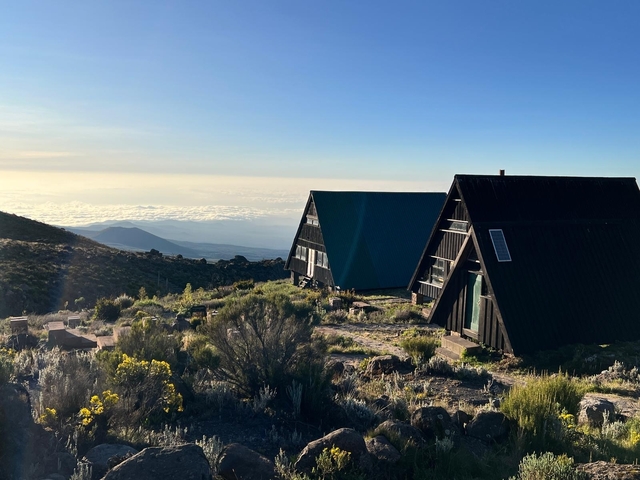 View of A-frame cabins on a mountainous landscape.