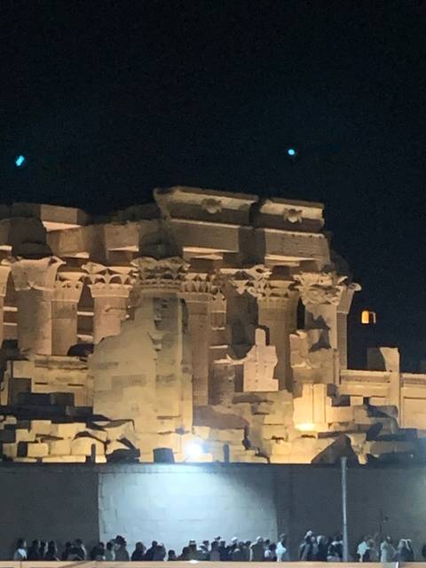       Temple columns lit up at night.
  