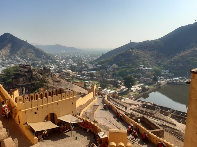 A panorama of a historic fort with surrounding city landscape.