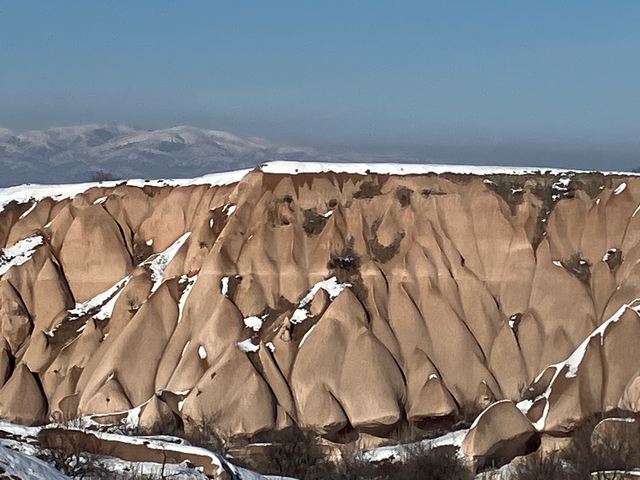       Unique rock formations with some snow in Cappadocia, Turkey.
  