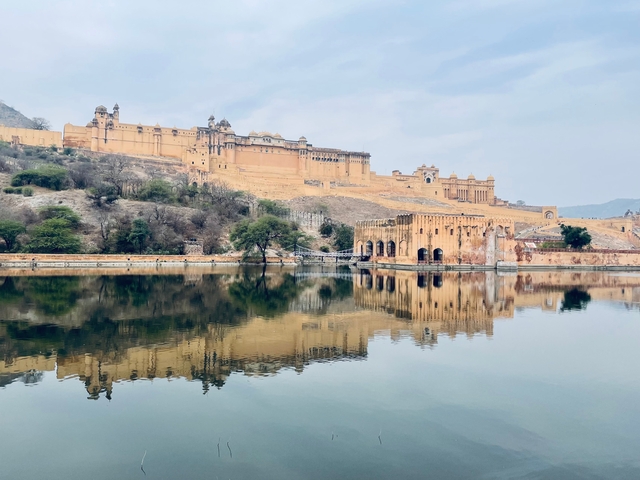       A large fort reflected in a lake.
  