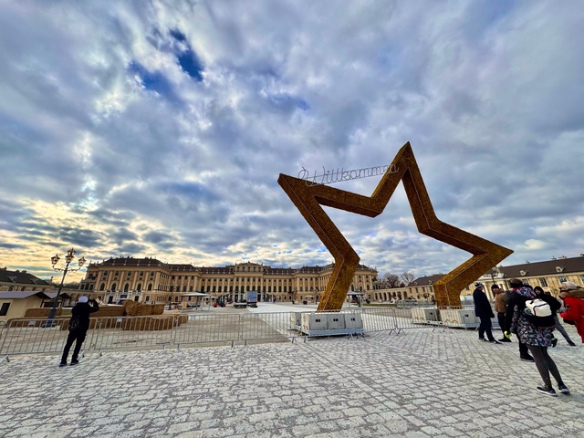 Historic palace entrance with a star-shaped sculpture.