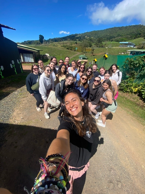 A group of people happily posing together.