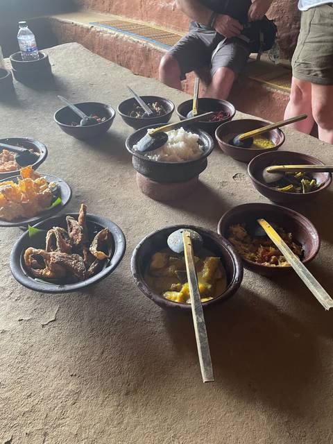 Traditional Sri Lankan food served in clay bowls.