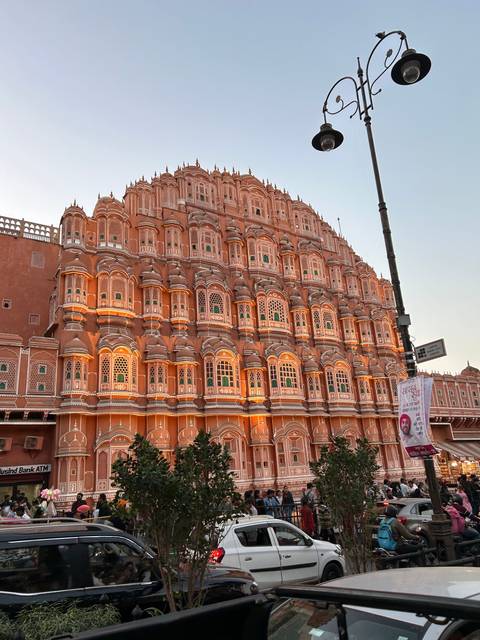 The Hawa Mahal illuminated at sunset.