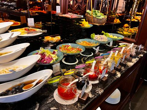       Buffet setup with various dishes and condiments.
  