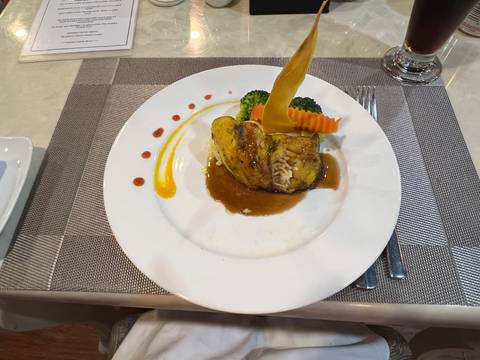       A beautifully presented dish on a dining table.
  