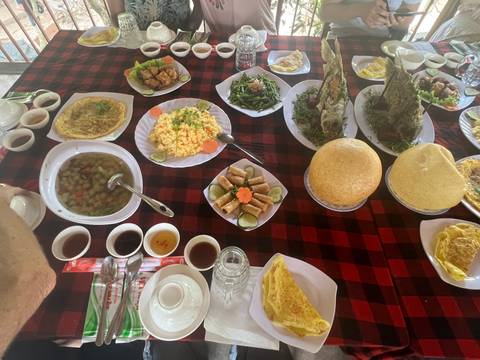       A table full of various traditional food dishes.
  