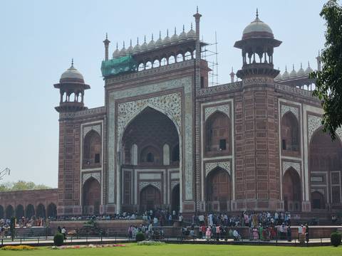 Ornate entrance of a red sandstone building.