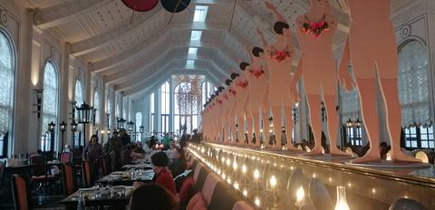 Interior of a restaurant with unique decor and patrons dining.