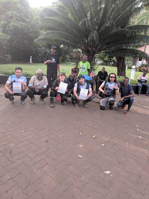 Celebratory group photo with certificates after a trek.
