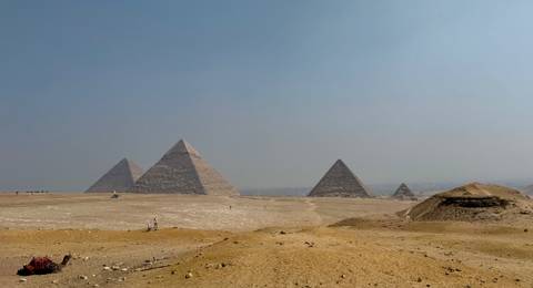       The Pyramids of Giza with a desert foreground.
  
