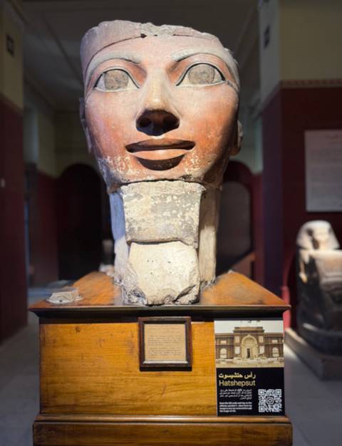       Sculpture of an ancient head with a broken chin.
  