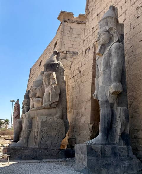       Colossal statues at an ancient temple.
  