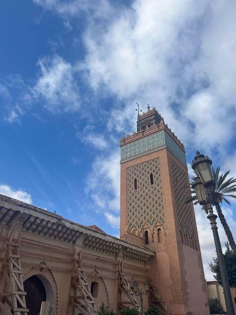 The Koutoubia Mosque minaret in Marrakesh with a clear sky.
