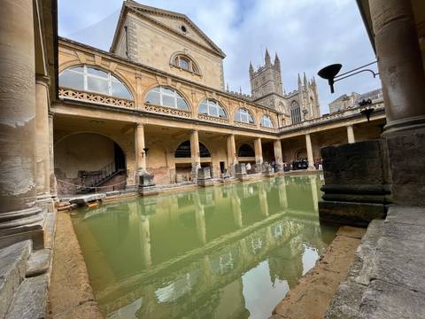       Roman Baths with Bath Abbey in the background.
  
