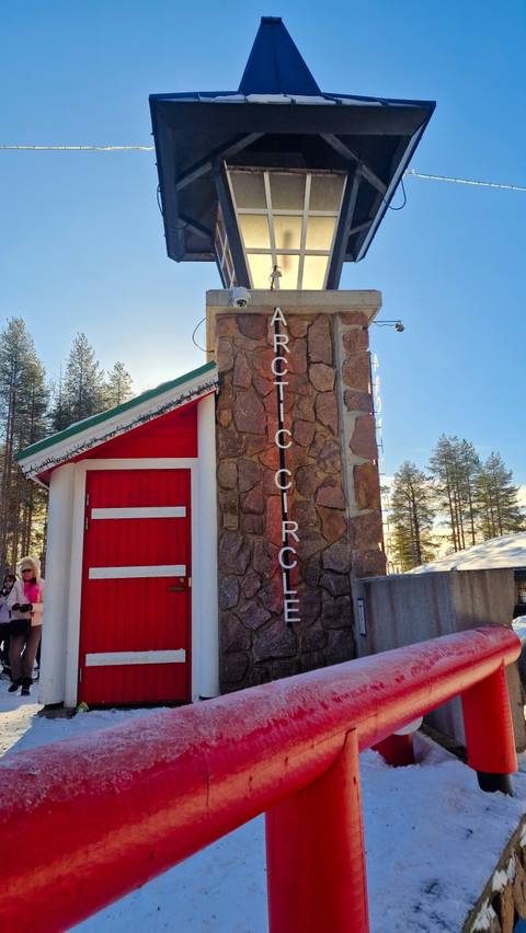 Arctic Circle marker with a red door structure.