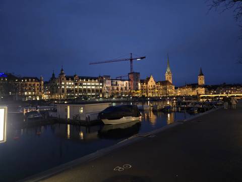 Evening cityscape reflection on a lake in Zurich.