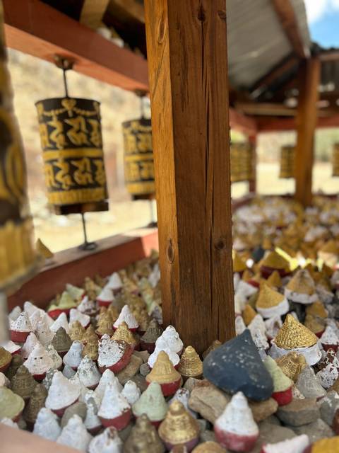 Prayer wheels and religious offerings.