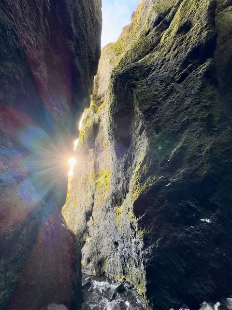 Ray of sunlight through rock formations.