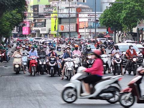 Busy street with many motorbikes.