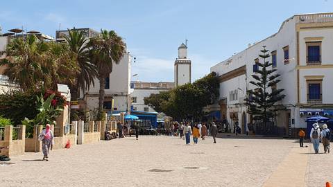 Pedestrian street with traditional Moroccan architecture.