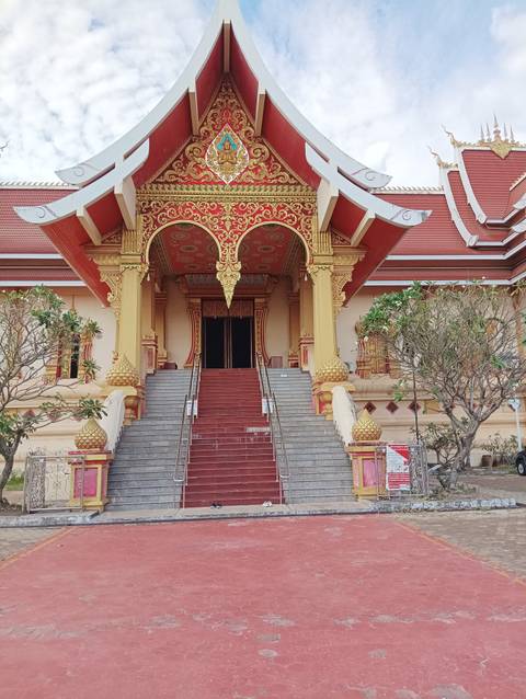 Steps leading to an ornately designed temple entrance.