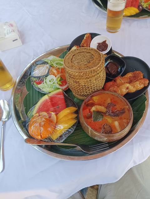 A colorful plate of traditional Laotian food.
