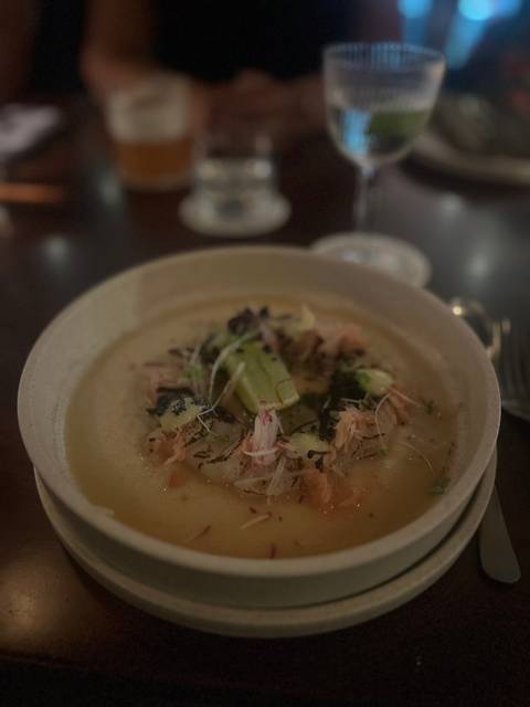       Close-up of a dish on a plate with low lighting.
  