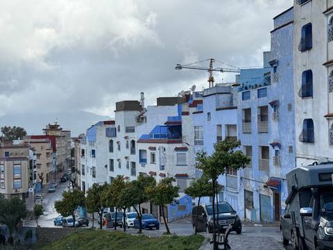 Colorful buildings under a cloudy sky.