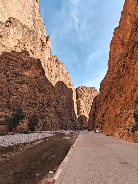 A breathtaking gorge with dramatic cliffs and a clear sky.