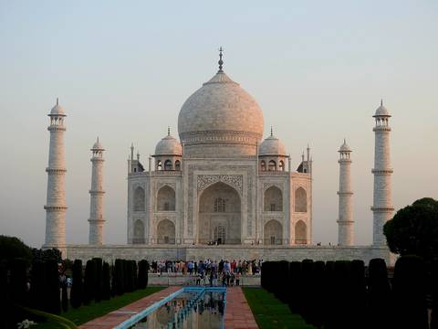 The iconic Taj Mahal with its grand structure and reflecting pool.