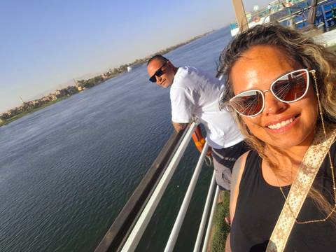 People enjoying a river view from a boat