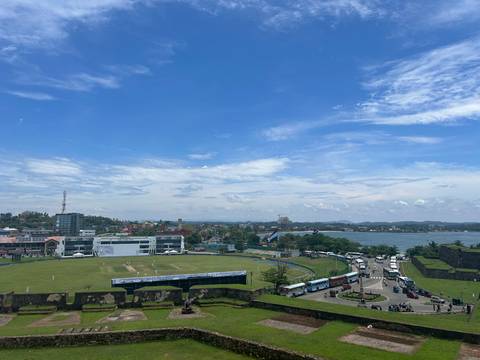 Cricket ground with a coastal view.