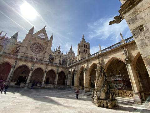       Gothic cathedral with arches and a courtyard.
  