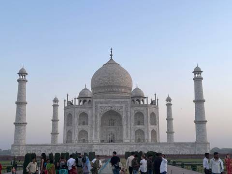       The iconic Taj Mahal with its central dome and minarets.
  