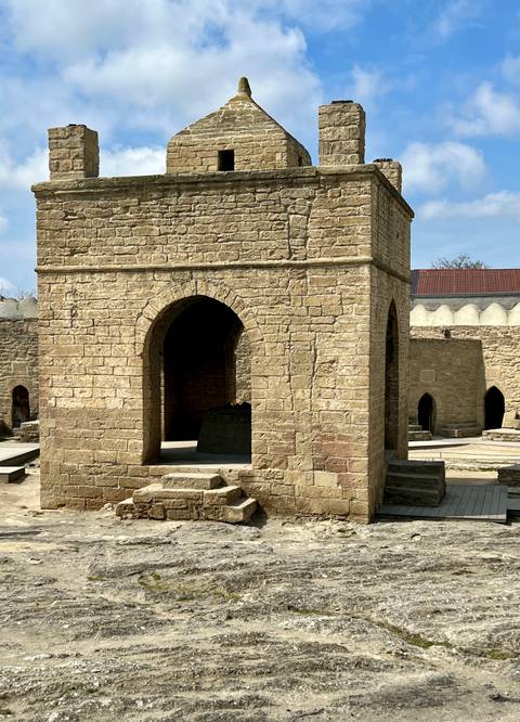       Stone-built structures with arches and doorways.
  