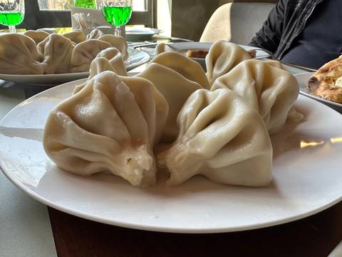      Traditional Georgian dumplings on a plate.
  