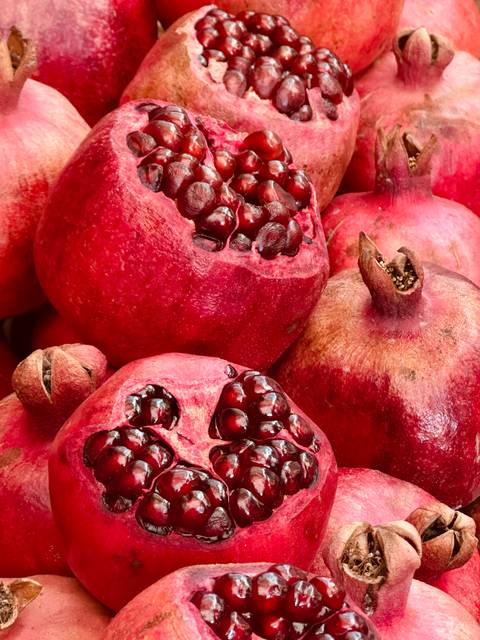       Close-up of vibrant pomegranates.
  