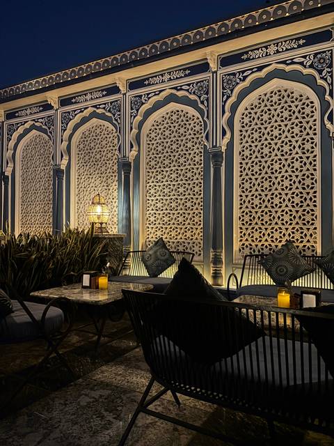       Elegant interior design with intricate patterns and a dimly lit atmosphere.
  