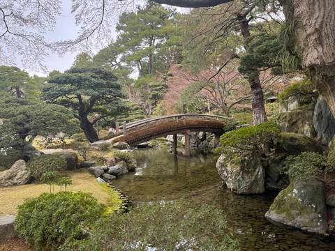 Formal garden with a rustic wooden bridge