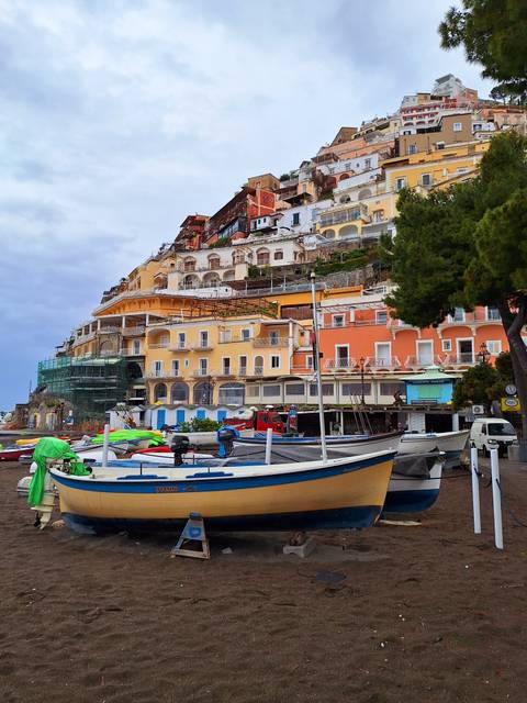 Colorful buildings on a hillside by the coast.