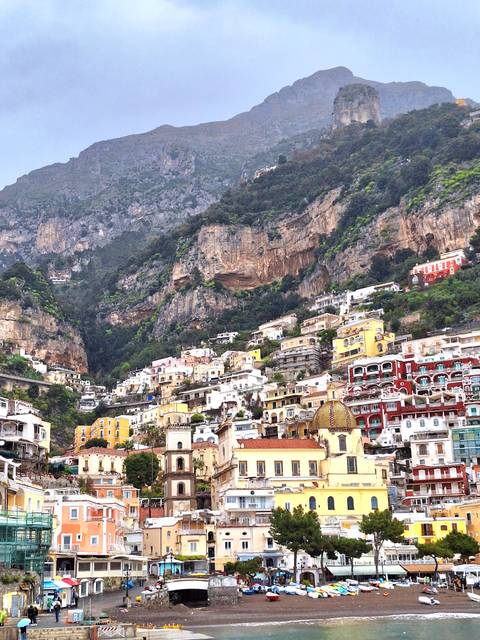 A hillside covered in colorful houses.