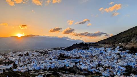 View of Chefchaouen at sunset with its iconic blue buildings.