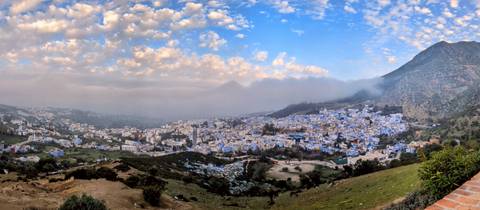 Panoramic view of Chefchaouen from a hillside.