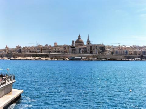 Cityscape view with historic buildings by the water.