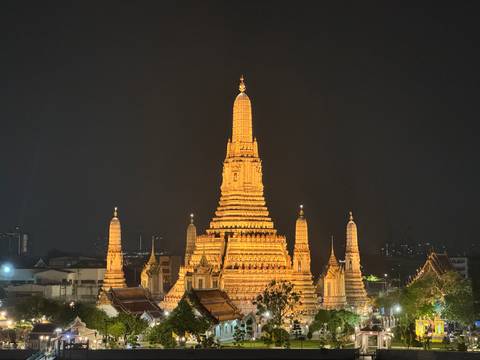 Illuminated temple complex at night.